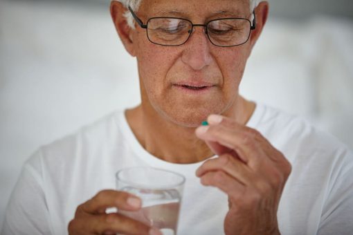 old man with pill