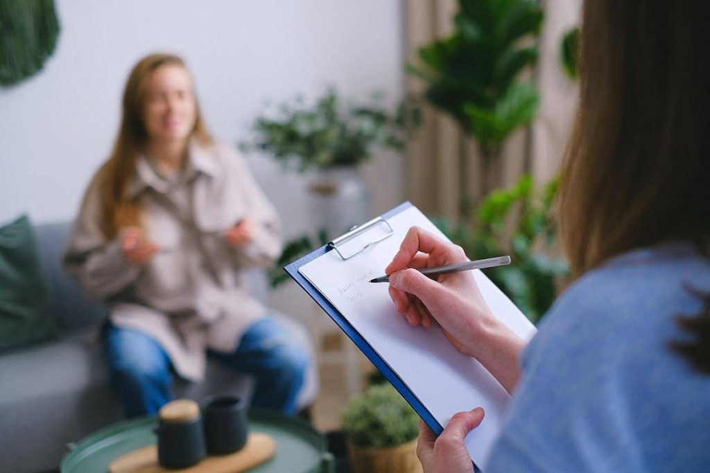 physician interview and physical exam with patient